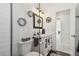Modern bathroom with elegant black fixtures and a glass-enclosed shower at 4829 Commonwealth Rd, Palmetto, FL 34221