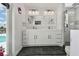 Bright bathroom with double sinks, modern fixtures, a large mirror, and a glass-enclosed shower at 4829 Commonwealth Rd, Palmetto, FL 34221