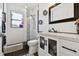 Stylish bathroom featuring a black-framed mirror and a glass-enclosed shower at 4829 Commonwealth Rd, Palmetto, FL 34221