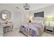 Charming bedroom with nautical-themed quilt and white wicker furniture at 4829 Commonwealth Rd, Palmetto, FL 34221