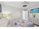 Nautical themed bedroom with a white dresser, a modern fan, and a TV at 4829 Commonwealth Rd, Palmetto, FL 34221