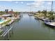 Waterfront property with scenic canal views, docks, and boats. Ideal for boating and enjoying waterfront living at 4829 Commonwealth Rd, Palmetto, FL 34221