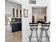 View of the kitchen and dining room featuring bar stools and modern decor at 4829 Commonwealth Rd, Palmetto, FL 34221