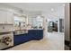 Bright kitchen boasts stainless steel appliances, blue lower cabinets, subway tile backsplash and lots of natural light at 4829 Commonwealth Rd, Palmetto, FL 34221