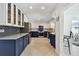 Modern kitchen with two-tone cabinetry, subway tile backsplash, and stainless steel appliances at 4829 Commonwealth Rd, Palmetto, FL 34221