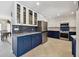 Stylish kitchen featuring two-tone cabinetry, glass display cases, and modern appliances at 4829 Commonwealth Rd, Palmetto, FL 34221