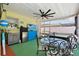 A bright lanai features a dining table, television, wet bar and leads to an outdoor jacuzzi at 4829 Commonwealth Rd, Palmetto, FL 34221