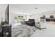 Open-concept living room featuring tile floors and ample seating at 4829 Commonwealth Rd, Palmetto, FL 34221
