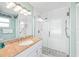Modern bathroom with a glass-enclosed shower, granite countertop, and stylish vanity at 507 Spring Ave, Anna Maria, FL 34216