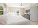 Spacious bedroom features a comfortable bed, balcony access, and a cozy sitting area at 507 Spring Ave, Anna Maria, FL 34216