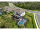 Aerial view of a beautiful property featuring a screened-in pool and spacious backyard at 5651 Trevesta Pl, Palmetto, FL 34221