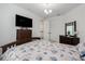 Bright bedroom featuring matching furniture and a comfortable bedspread with marine patterns at 5651 Trevesta Pl, Palmetto, FL 34221