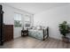 Comfortable bedroom with a daybed, side table, dresser, and plenty of natural light from the windows at 5651 Trevesta Pl, Palmetto, FL 34221