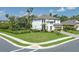 Stunning two-story home boasting a manicured lawn, lush landscaping, and a screened-in pool at 5651 Trevesta Pl, Palmetto, FL 34221