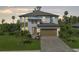 Charming two-story home featuring a two-car garage, landscaped yard, and a welcoming entrance at 5651 Trevesta Pl, Palmetto, FL 34221