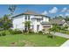 Beautiful home featuring a well-maintained lawn, lush landscaping, and a screened-in pool at 5651 Trevesta Pl, Palmetto, FL 34221