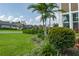 Well-manicured front yard featuring a lush green lawn and beautiful landscaping at 5651 Trevesta Pl, Palmetto, FL 34221