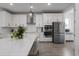 Bright, updated kitchen with stainless steel appliances, stylish white cabinets, and island at 5651 Trevesta Pl, Palmetto, FL 34221