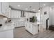 Modern kitchen with island, stainless steel appliances, white cabinets and plenty of space at 5651 Trevesta Pl, Palmetto, FL 34221