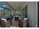 Spacious screened patio with plenty of seating, ideal for entertaining or relaxing outdoors at 5651 Trevesta Pl, Palmetto, FL 34221
