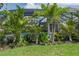 Enjoy the pool view from the lush landscaping and privacy of your backyard oasis at 5651 Trevesta Pl, Palmetto, FL 34221