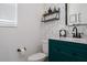 Stylish powder room featuring designer wallpaper, elegant vanity, and modern fixtures at 5651 Trevesta Pl, Palmetto, FL 34221