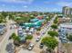Aerial view of Siesta Key Village shops and restaurants on a sunny day at 5681 Midnight Pass Rd # 104, Sarasota, FL 34242