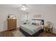 Bedroom featuring hardwood floors, natural light, and neutral decor at 5681 Midnight Pass Rd # 104, Sarasota, FL 34242