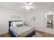 Bedroom features hard wood floors, ceiling fan, and neutral colored decor at 5681 Midnight Pass Rd # 104, Sarasota, FL 34242