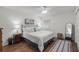 Cozy bedroom with a queen-size bed, hardwood floors, and natural lighting at 5681 Midnight Pass Rd # 104, Sarasota, FL 34242