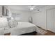 Cozy bedroom showcasing hardwood floors, closet, and natural light at 5681 Midnight Pass Rd # 104, Sarasota, FL 34242