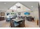 Bright community dining area with vaulted ceilings, ceiling fan, and a sliding glass door leading to the pool at 5681 Midnight Pass Rd # 104, Sarasota, FL 34242