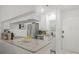 Bright kitchen with stainless steel appliances and granite countertops, ample counter space at 5681 Midnight Pass Rd # 104, Sarasota, FL 34242