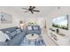 Inviting living room showcasing modern furnishings and an open layout with views to the dining area at 5681 Midnight Pass Rd # 104, Sarasota, FL 34242