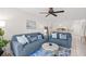 A cozy living room featuring stylish sofas, coastal-themed decor, and an open concept design at 5681 Midnight Pass Rd # 104, Sarasota, FL 34242