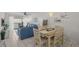 Open floor plan with dining area, living room, and balcony access in a bright and airy space at 5681 Midnight Pass Rd # 104, Sarasota, FL 34242
