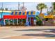 Colorful Lobster Pot seafood restaurant with awning and signage on the street at 5681 Midnight Pass Rd # 104, Sarasota, FL 34242