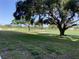 The beautiful green grass in this backyard leads to a picturesque view of the nearby golf course at 6124 43Rd W St # 104A, Bradenton, FL 34210