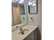 Bathroom featuring a single sink vanity with storage and two mirrors above at 6124 43Rd W St # 104A, Bradenton, FL 34210