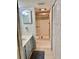 Cozy bathroom with a walk-in shower, single sink vanity, and convenient storage cabinet at 6124 43Rd W St # 104A, Bradenton, FL 34210