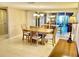 Inviting dining room featuring tile floors, mirrored walls, and a chandelier, perfect for entertaining guests and Gathering at 6124 43Rd W St # 104A, Bradenton, FL 34210