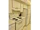 Functional kitchen featuring white appliances and cabinetry offering a bright and clean space for preparing meals at 6124 43Rd W St # 104A, Bradenton, FL 34210