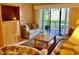 Comfortable living room featuring sliding glass doors to a patio, plush seating, and neutral decor for a relaxing atmosphere at 6124 43Rd W St # 104A, Bradenton, FL 34210