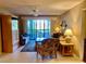 Cozy living room with tiled floors, a ceiling fan, and sliding glass doors that open to an outdoor patio at 6124 43Rd W St # 104A, Bradenton, FL 34210