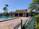 Enjoy the community pool and clubhouse with plenty of seating and views of palm trees at 6124 43Rd W St # 104A, Bradenton, FL 34210