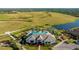 Aerial view of the clubhouse, pool, and surrounding green spaces at 6250 Grandview Hill Ct, Bradenton, FL 34203