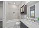 Bathroom features a shower/bathtub combination and vanity with mirror and storage at 6250 Grandview Hill Ct, Bradenton, FL 34203