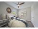 Relaxing bedroom with soft lighting, a tray ceiling, decorative art, and a comfortable queen bed at 6250 Grandview Hill Ct, Bradenton, FL 34203