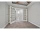 Bedroom boasts french doors to a bathroom and walk-in closet at 6250 Grandview Hill Ct, Bradenton, FL 34203