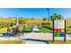Enjoy a friendly game of bocce ball on this well-maintained court with manicured landscaping and seating area at 6250 Grandview Hill Ct, Bradenton, FL 34203